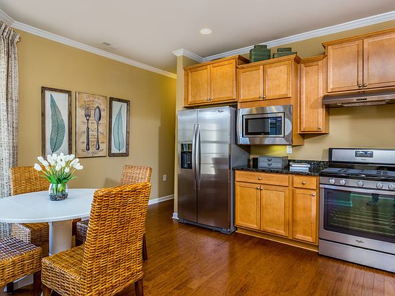 Kitchen with your choice of granite or quartz countertops, overlooks the gathering room