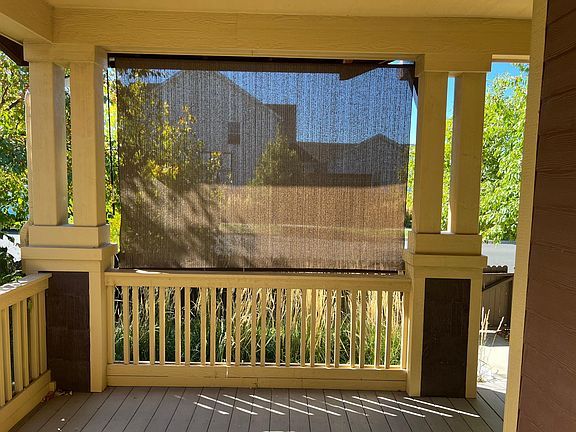 The porch with the sunscreen down.