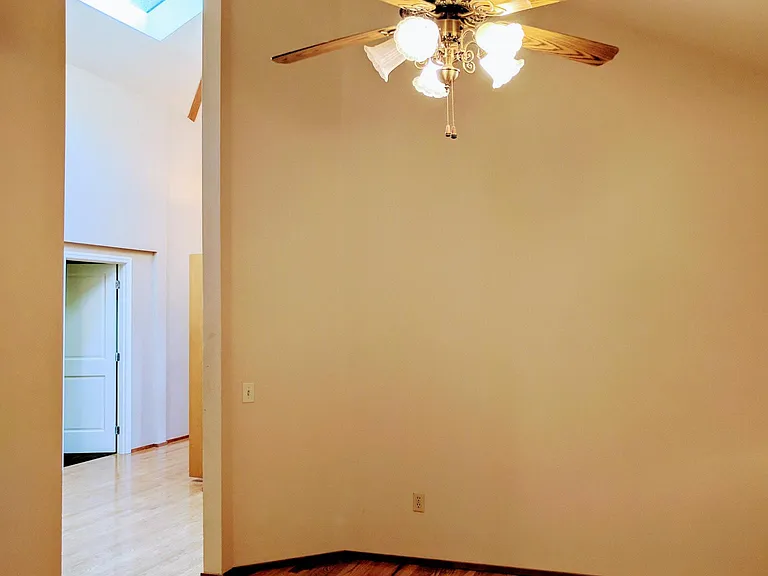 Skylights and vaulted ceiling add new dimensions to the hallway and formal dining room.