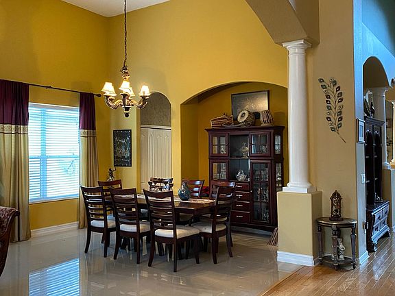 tiled dining area with 20 ft vaulted celing