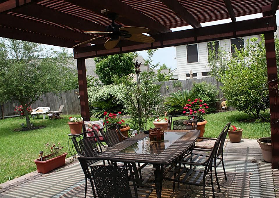 Pergola covering for extended patio.