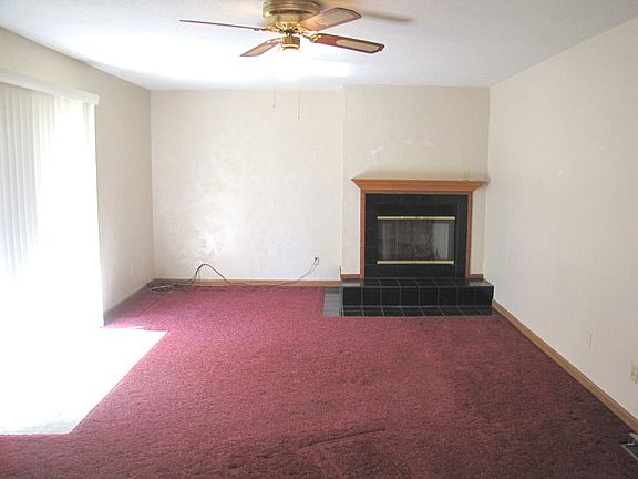 Spacious family room /fireplace located behind garage