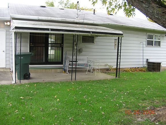 Fenced in back yard with covered patio