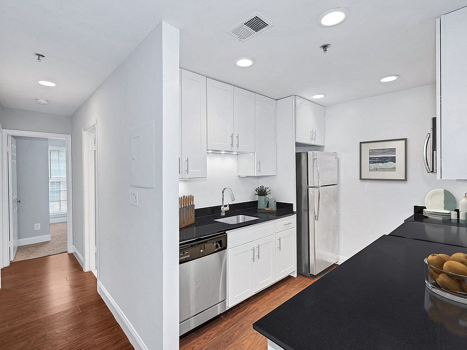 Sleek kitchens with granite counters and stainless steel appliances