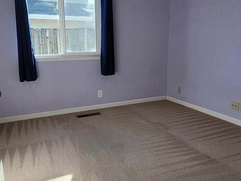Bright third bedroom with abundant natural light