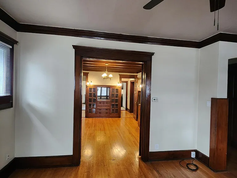 Living room looking toward dinning room with French doors open.
