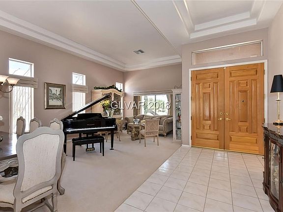 Grand double door entrance into the Formal Living and Dining Room