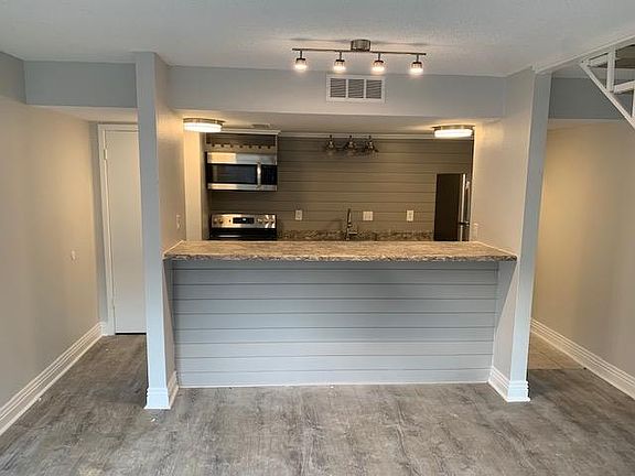 Pass through bar, Water heater on the left closet with shelving above
