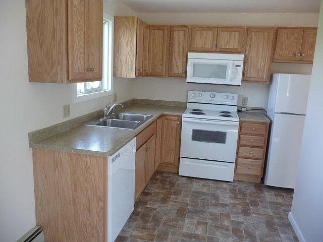 Kitchen was updated 4 years ago with stainless steel appliances (apartment sized refrigerator, electric stove, dishwasher and microwave oven.
