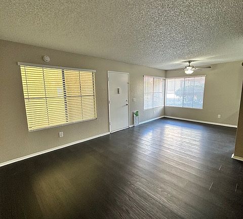 View from corner of the living room towards dining area/kitchen