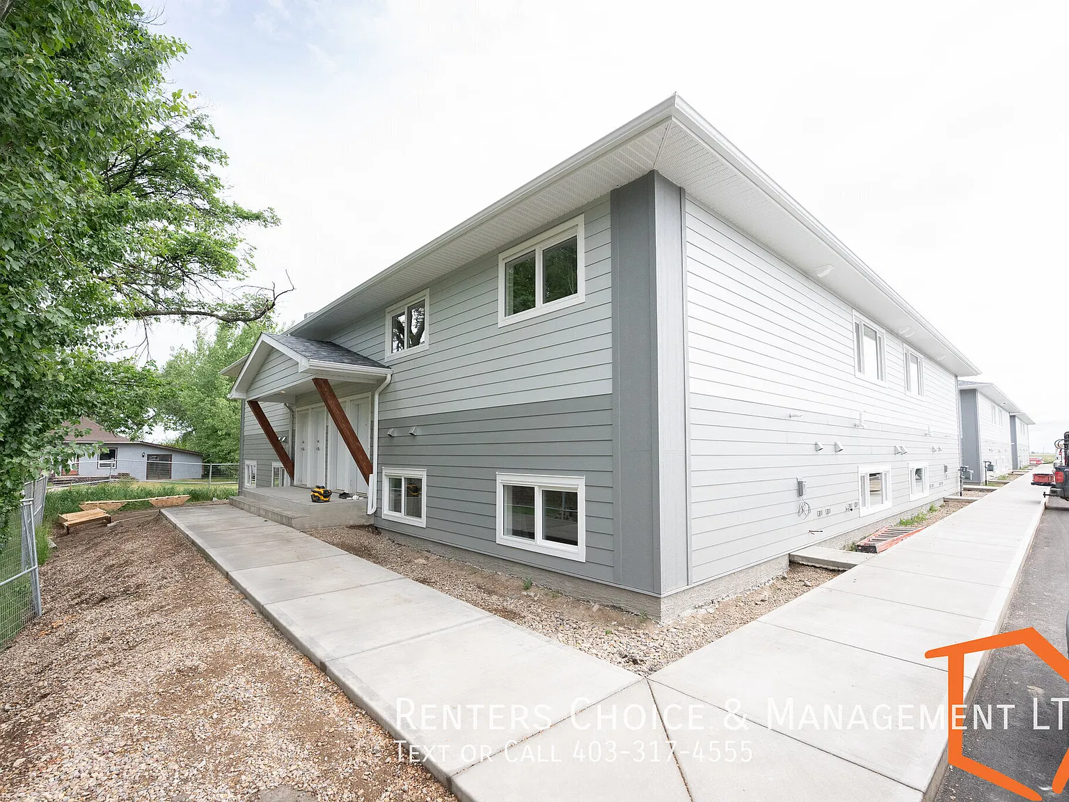 New 2 Bedroom Main Floor Unit With Assigned Parking — Photo 1