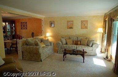 Formal dining room and spacious living room, both with custom paint.
