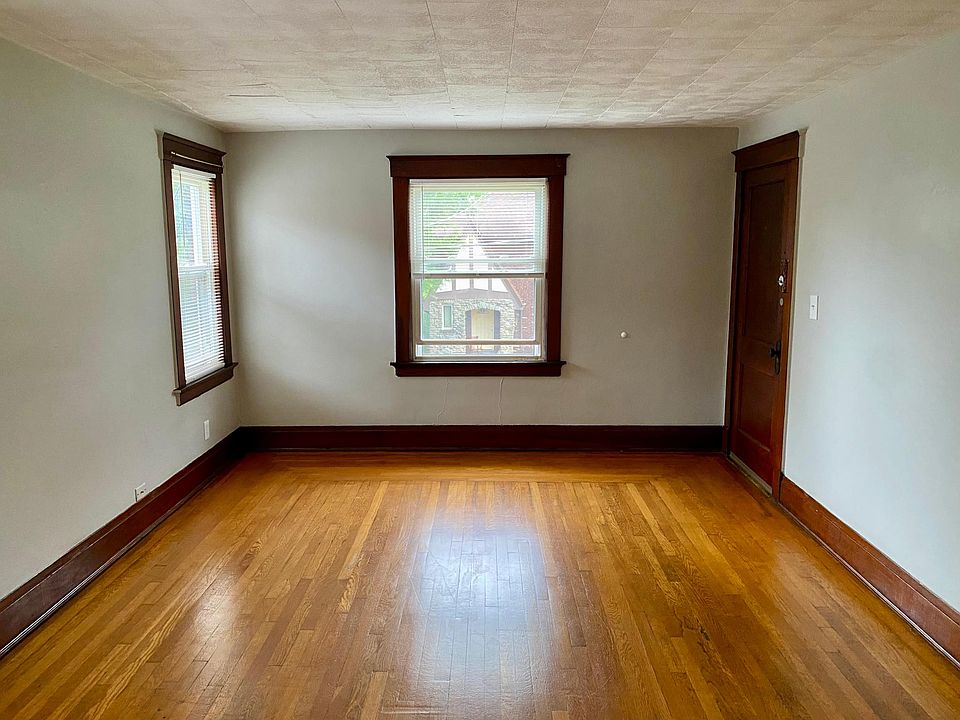 Large living room with plenty of natural light and beautiful hardwood flooring