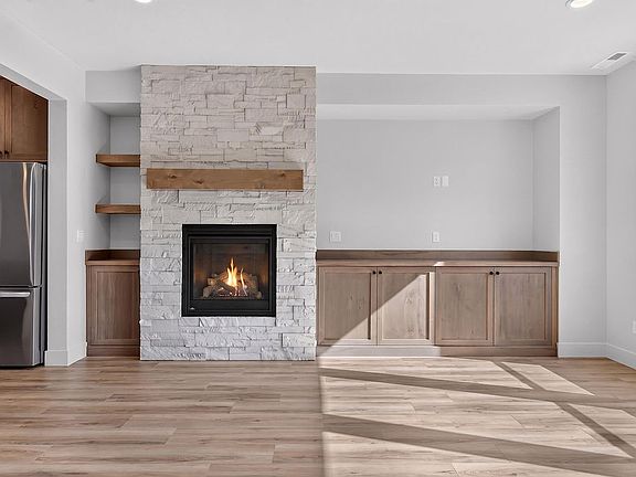 Gas fire place, additional built in storage cabinets and shelving.