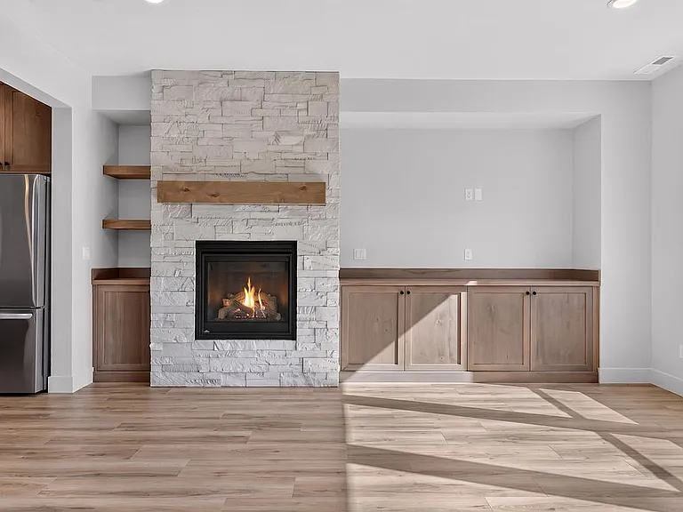 Gas fire place, additional built in storage cabinets and shelving.