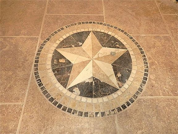 Texas pride! Tile inset just as you enter.