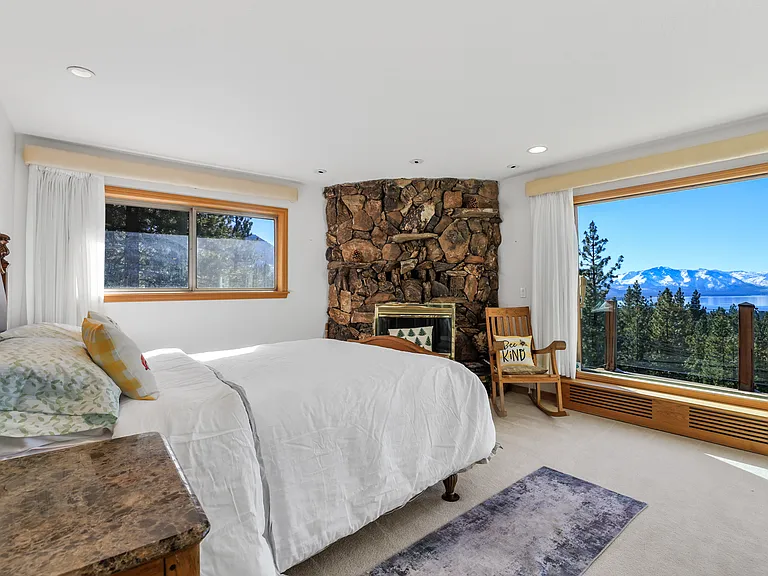 Master bedroom with queen bed and views