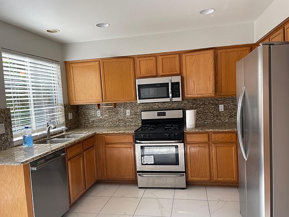 Kitchen with Granite counter top and steel appliances