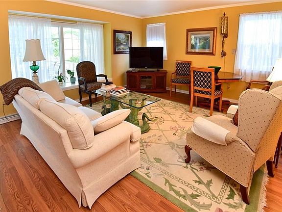 Note Glistening Floors! Lots of Oversized windows!