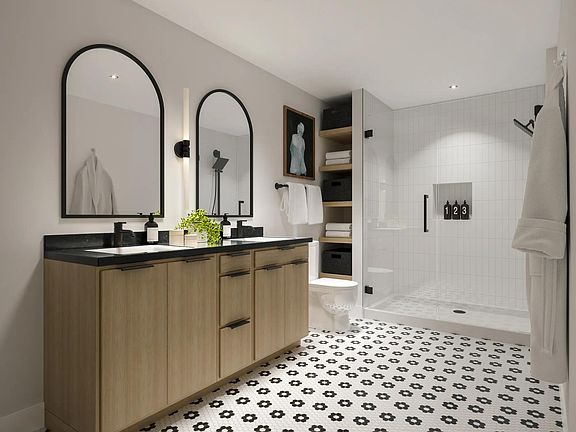 Select apartment homes at Modera Nations feature frameless glass showers with floor-to-ceiling tile surrounds.