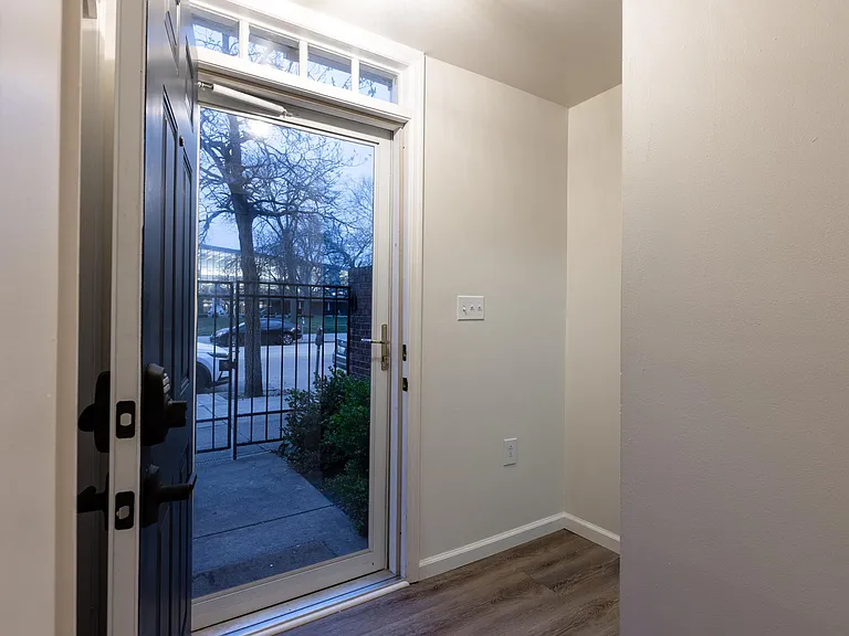Front door, entry way. Coat closet on left side, laundry room, and garage door on this level