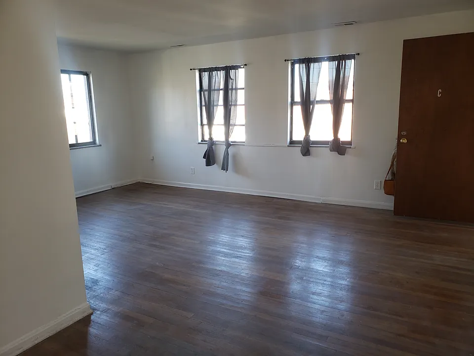 living room with 3 windows and additional space for dinning table