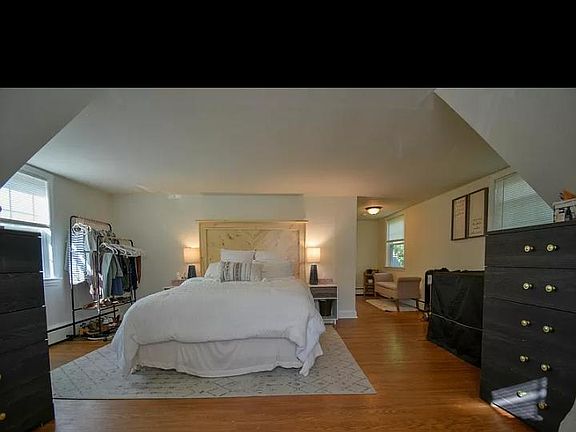 Large master bedroom with double closets, hardwood floors and 3 windows for great natural light. Would fit a king sized bed easily