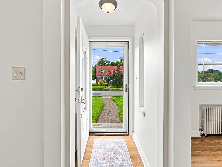 entry way with coat closet on left