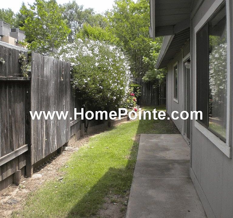 Side yard leading to private back yard.