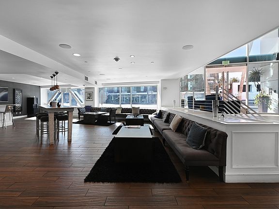 Experience luxurious comfort in this expansive, light-filled lounge.