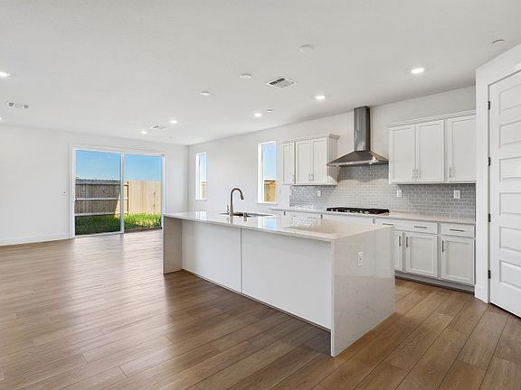 Open kitchen with waterfall edge island