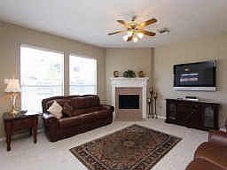 Large family room with fireplace, 2 inch blinds and beautiful new carpet as of