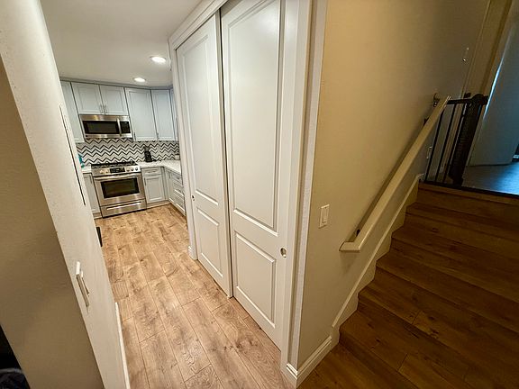 Stairs lead to both bedrooms and bathrooms