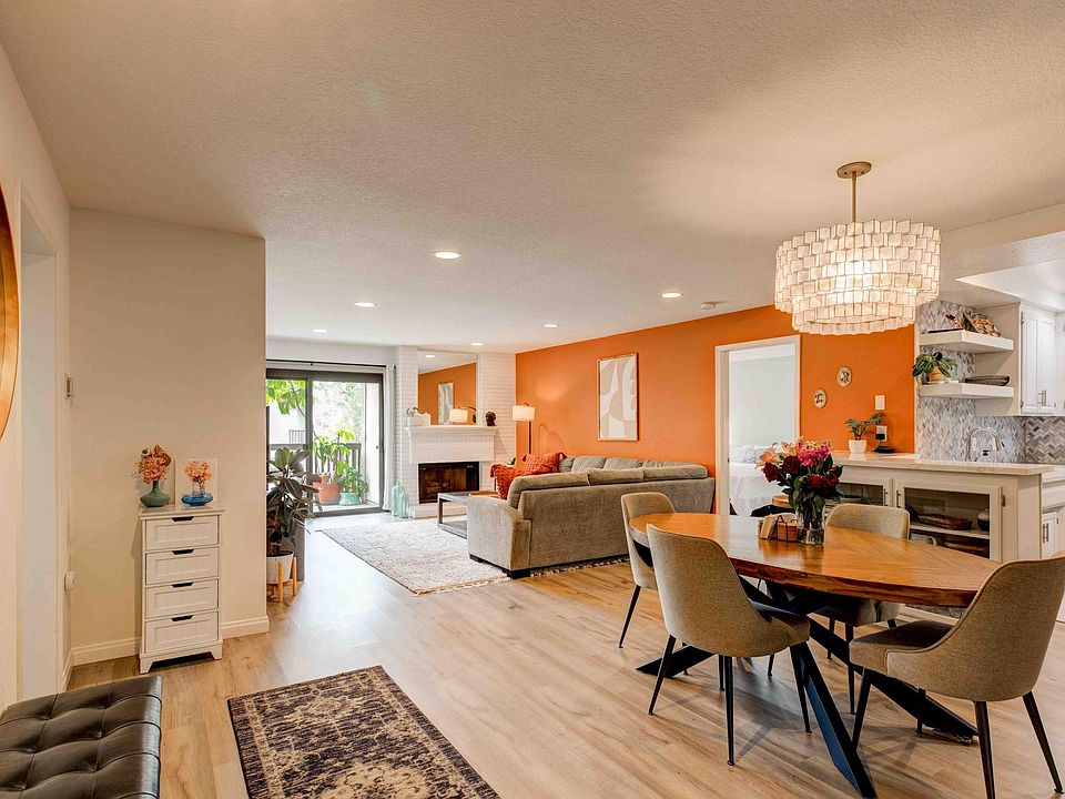 Spacious dining room, living room and fireplace. Sliding doors to the patio.