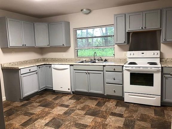 Large Kitchen, with new cabinets, counters, and dishwasher.