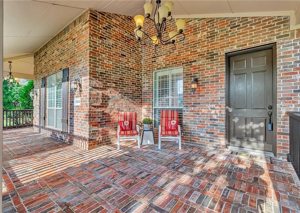 Porch wraps around front with view of Stacy Ridge Estates Park.