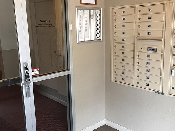 View of secured entrance and mail boxes