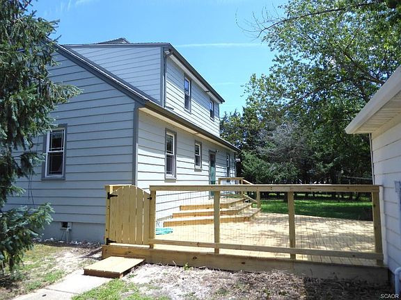 Rear with huge new deck and fully fenced yard