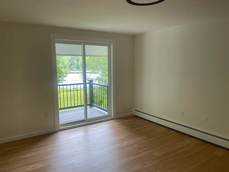 Bedroom over looking the balcony and the pond