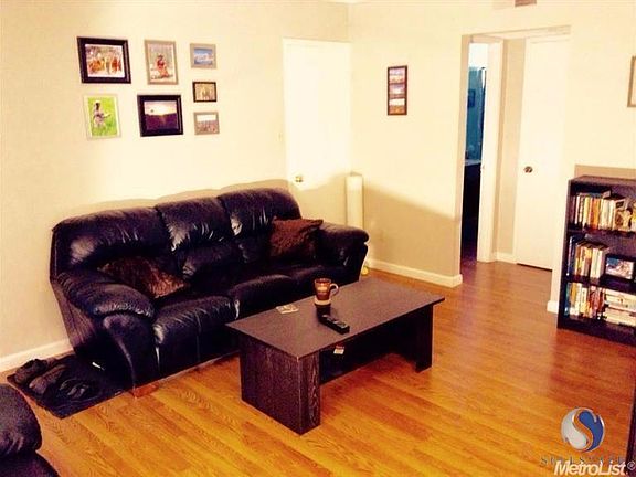 Living area and bathroom entry.