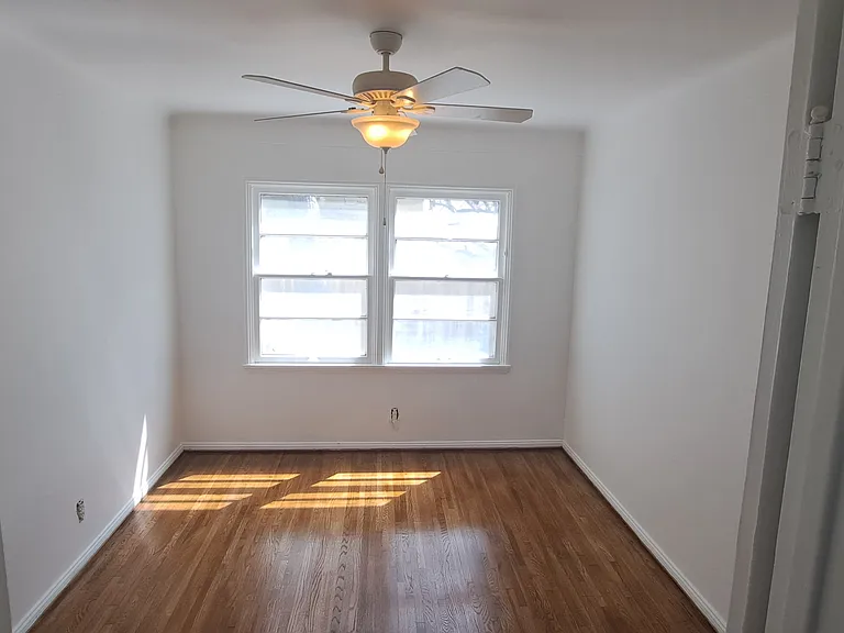 10'x13' Bedroom with ceiling fan, new curtains and window ac unit. New hardwood floors. 

Here is walk through video of the unit: 

Here is walk through video of the unit: