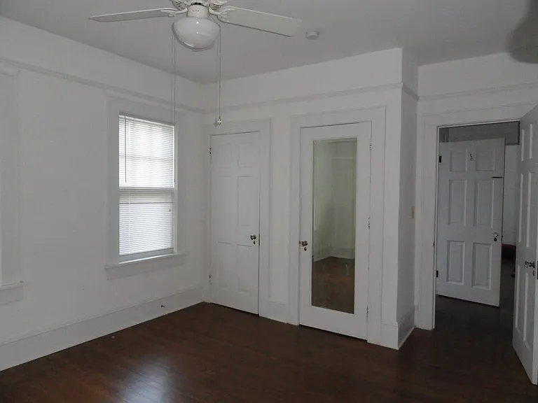 Master bedroom with his and her closets.