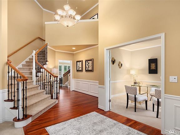 Enjoy this great office/den flex room off the main entry as you walk into this sweeping entry with broad staircase and Brazilian cherry hardwood throughout the main. Main floor has an additional guest suite. Full home built-in vacuum system.