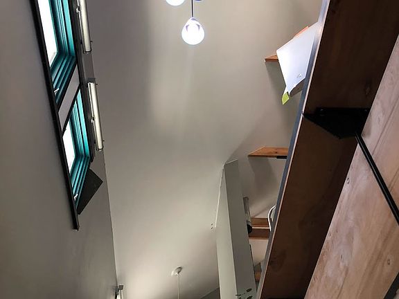 View of the Cathedral Ceiling from the Stairs. Plenty of Daylight from West facing windows with roll up shades