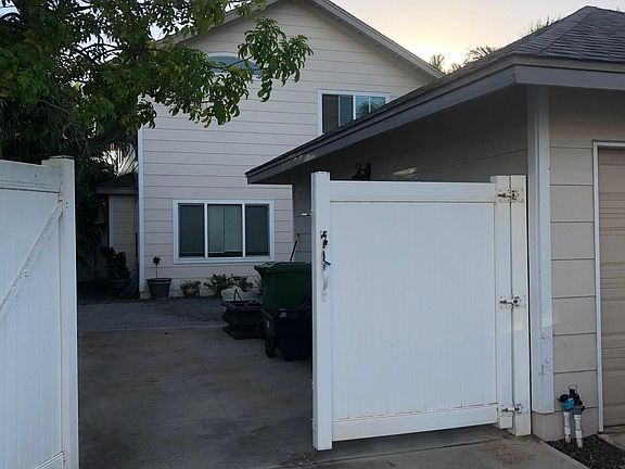 Gated Yard with 3 car / Full Size vehicle. Also has 2 car garage.