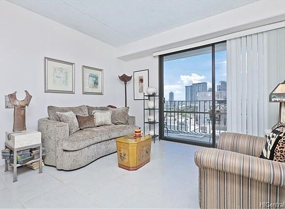 Opposite shot of living room and large lanai sliding doors.