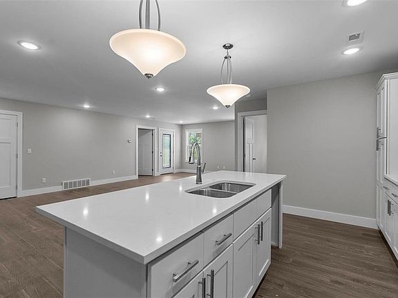 Kitchen is open to living room and dining area.