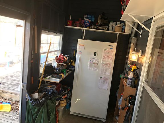 Screened in back porch with shelving