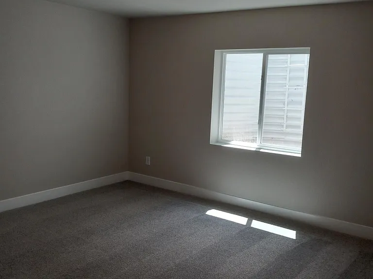 Bedroom 3 downstairs, four-foot by four-foot waist-level window.