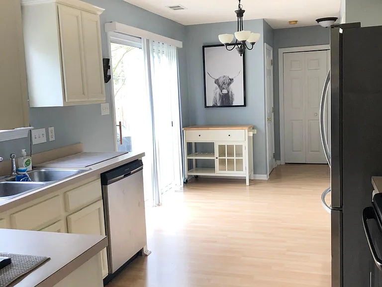 Light! Kitchen with updated appliances and freshly painted cabinets